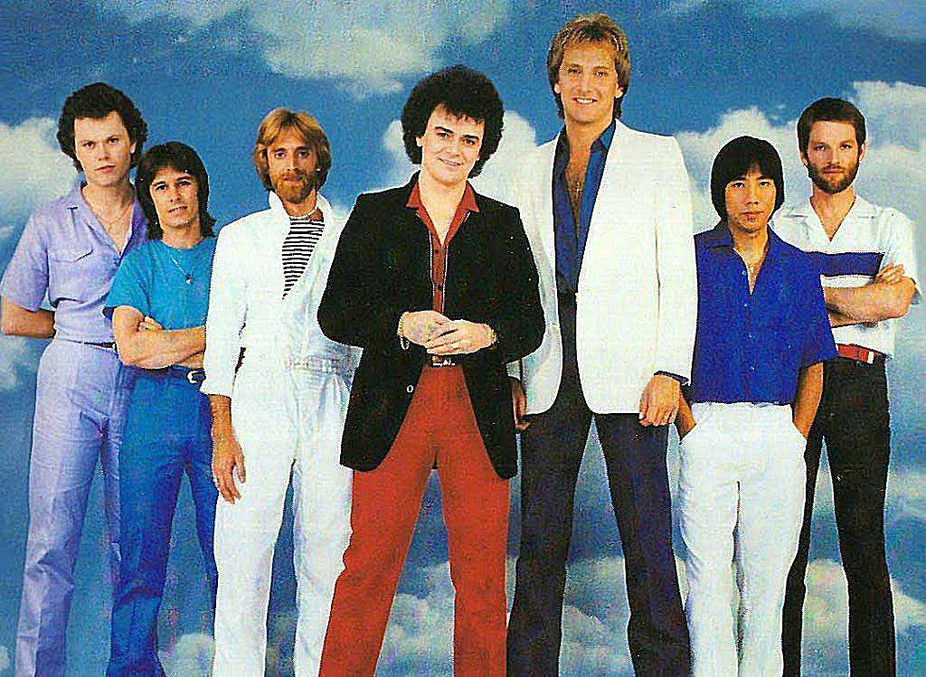 The 80's band, Air Supply, with a cloud background
